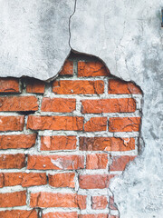 Brick wall. Fallen plaster. Stone, concrete background