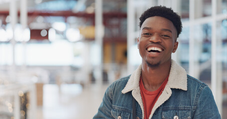 Obraz premium Black man, face and smile portrait in building for designer success, positive mindset and employee standing in lobby. African man, portrait and happy for innovation vision or entrepreneur headshot