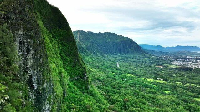 Aerial view Pali Lookout, mountain cliff on Oahu windward side. Drone Hawaii. tourism destination landmark, vacation travel. 