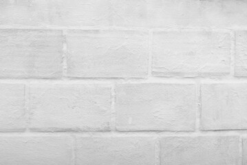 White brick wall in the foreground. Background, texture.