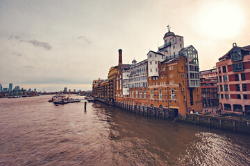 Naklejka premium Butlers Wharf now luxury apartments near the Tower Bridge on the South Bank of The River Thames, London, England, UK