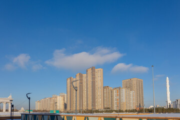 Fototapeta premium Modern residential buildings on sunny winter day, Nur-Sultan, Astana, Kazakhstan. High quality photo