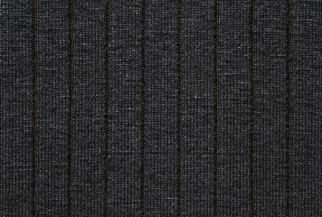 Soft black color ribbed jersey fabric pattern close up as background