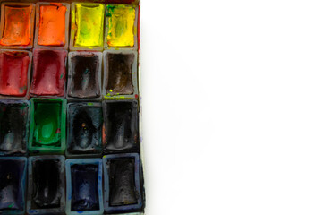 Watercolor paints on a white background.