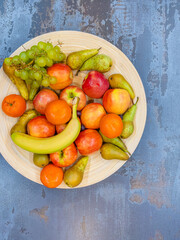 fruits plate with fresh grapes, pears, apples