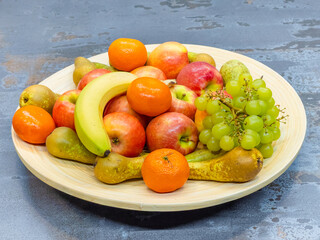 fruits plate with fresh grapes, pears, apples