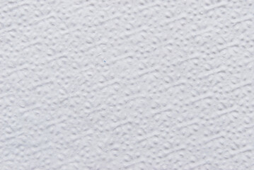 A sheet of white structured white tissue paper as background 