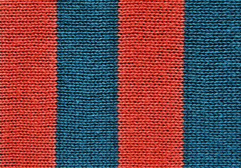 Blue and orange color striped jersey fabric texture as background
