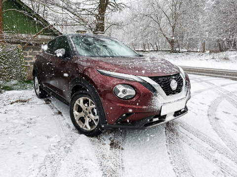 03.02.2023 Kyiv, Ukraine : New Nissan Juke 2022 year in Burgundy color at winter time