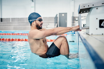 Sports, swimming pool and man start race in water for training, exercise and workout for...