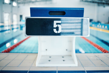 Sports, swimming pool and number on podium for training, exercise and workout for triathlon...