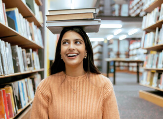 Books, balance or happy student in a library reading for knowledge or development for future...