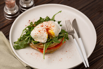 Squash waffles with poached egg, salmon and arugula