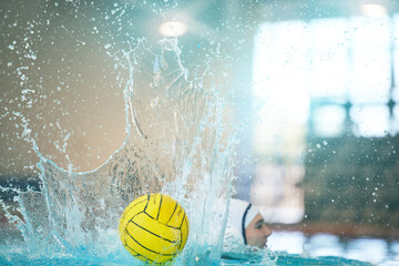 Water polo, ball and splash with athlete in swimming pool training, exercise and fitness game or...
