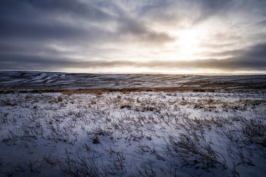 The frozen snow covered hills, countryside at sunrise of Muggleswick and Edmondbyers common, moor in winter near Blanchland, Northumberland  in England UK.