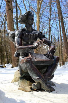 Truskavets, Ukraine - March 9, 2018: Statue of a gusli player in the Resort public park in Ukrainian spa resort Truskavets, famous for its mineral springs.
