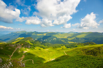 Green meadows in the mountains of Montenegro, national park, Kolasin, cable car, clouds and shadows on the ground