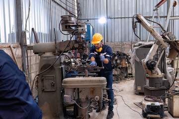 In robotic repair shop engineer use drilling machine fabricate part and vernier caliper measuring