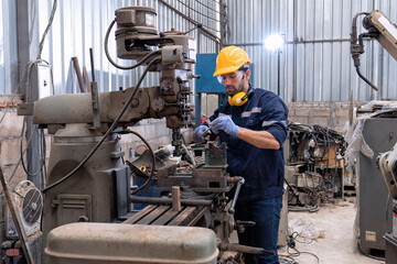 In robotic repair shop engineer use drilling machine fabricate part and vernier caliper measuring