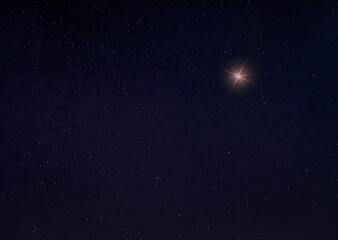 Single bright star on a starry night