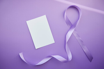 Mock of stationery card and purple ribbon for Purple Day - World Epilepsy Day, March of 26. Symbol of Epilepsy Day
