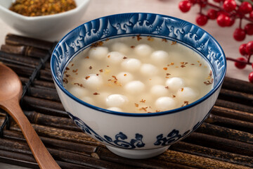 Little white tangyuan with sweet osmanthus honey and syrup soup.
