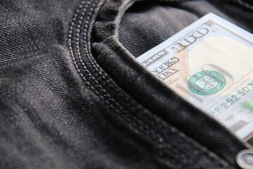 American dollars USD banknotes in jeans pocket.