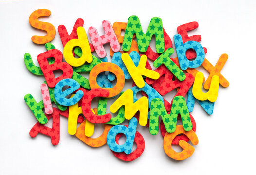 Top View Of Colorful Letter D Of The Alphabet For Learning To Write And Read. Colorful Abc On White Background. School Is Fun With Alphabet Magnets Game.