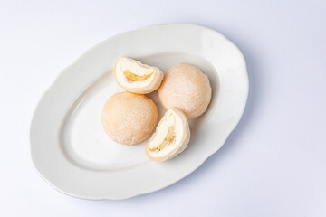 Fototapeta na wymiar Delicious mochi on a white background, close-up. Traditional Japanese dessert 