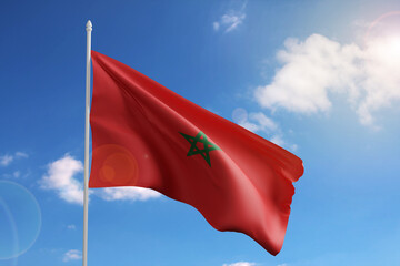 Flag of Morocco on blue sky. 3d illustration.