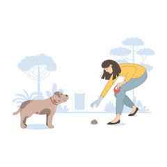 woman cleaning up after her dog in the park