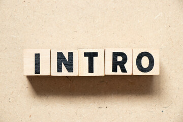 Alphabet letter block in word intro on wood background