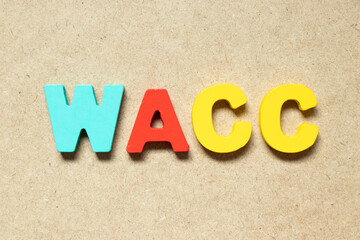 Color alphabet letter in word WACC (abbreviation of Weighted average cost of capital) on wood...