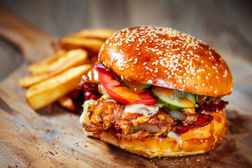  juicy burger with pork ribs, spicy sauce and fresh vegetables