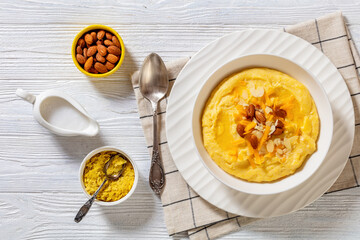 corn grits with butter, vegan cheese, and almonds