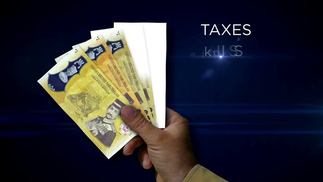 Brunei Dollar paper note holding. Fan of BND banknotes in hand. Metaphor concept of income loss, cost of live, tax, credits and money decline.