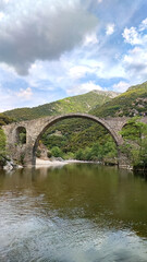 Fototapeta na wymiar Medieval Byzantine stone bridge over the river Kompsatos Rodopi Greece.