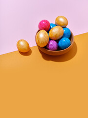 Creative layout with colored easter eggs on bright background. A template for festive content