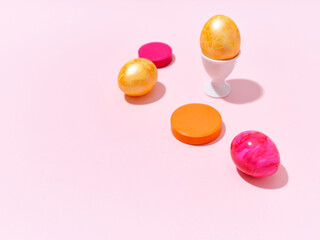 Creative layout with colored easter eggs on bright background. A template for festive content