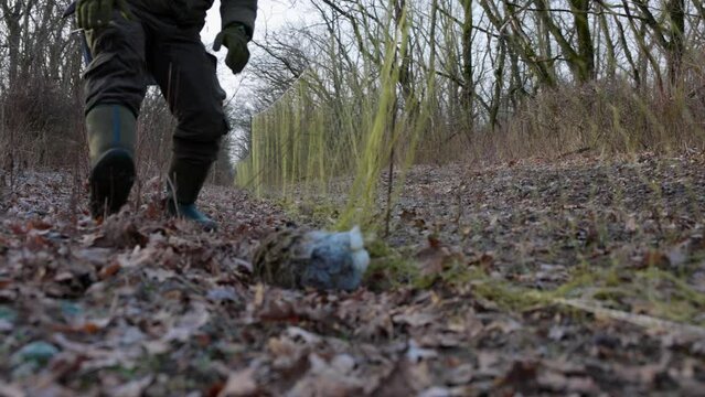 Wild hare caught in a trap net. Hare trapping for relocation. Resettlement of hunting resources. Unleashing the animal from the trap nets. 4K slow motion 120 fps video