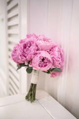 Pink wedding bouquet of peony. Sarah Bernhardt peonies. Wedding day.