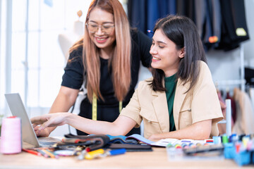 Senior fashion designer teamwork discuss teach learner final design share idea in shop lady tailor
