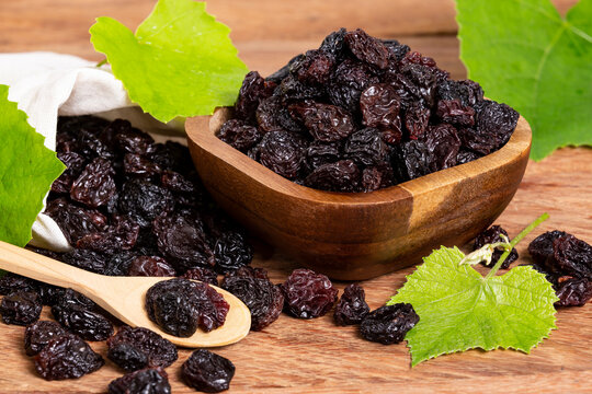 Healthy Food - Nuts Dehydrated Grapes; Photo On Wooden Background