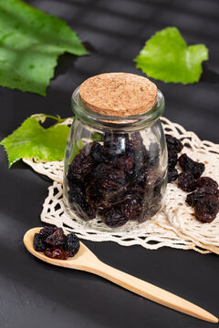 Healthy Food - Nuts Dehydrated Grapes; Photo On Dark Background