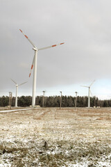 windmill farm or wind park, with high wind turbines for generation electricity.
