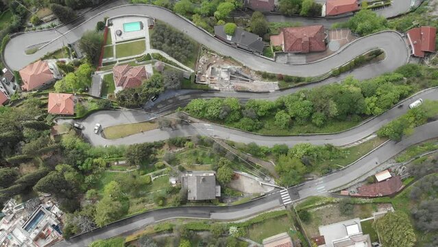 Italian serpentine road with moving cars