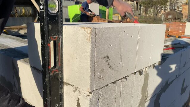 Foam block laying on a special mortar for laying blocks. 4k video footage