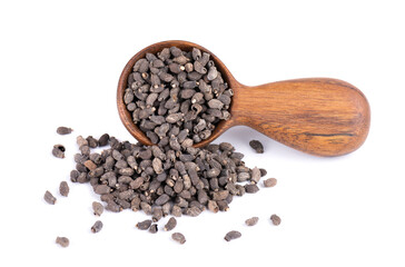 Borage seeds in wooden spoon, isolated on a white background. Borago officinalis seeds.