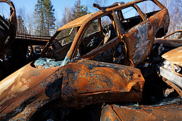 rusty cars that burned at a scrapyard outside Umea