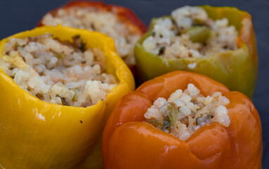 Stuffed peppers, colorful peppers stuffed with rice, top view. (Turkish name; stuffed peppers)